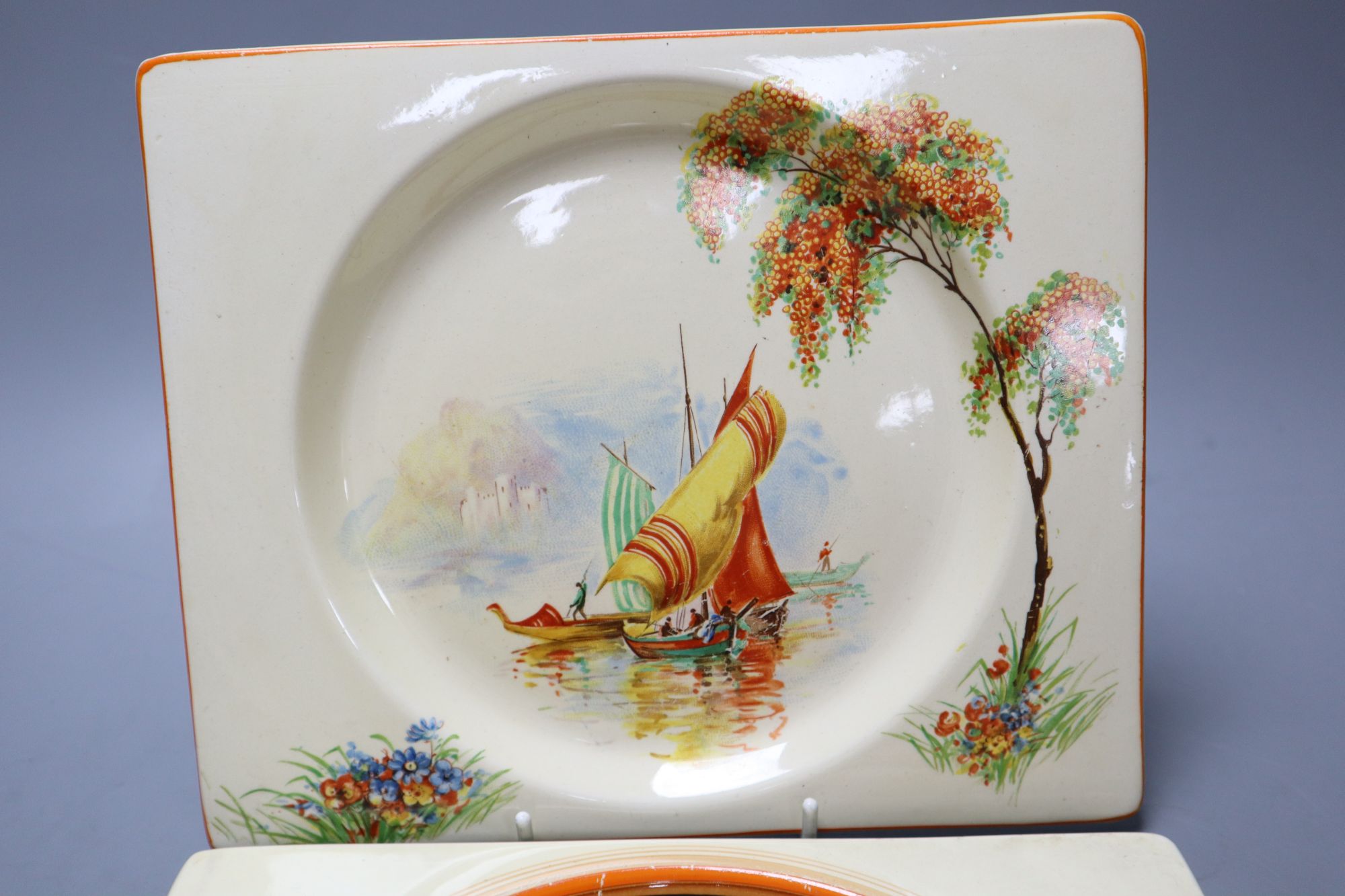 Two Clarice Cliff Biarritz shaped side plates, 19.5 x 23cm